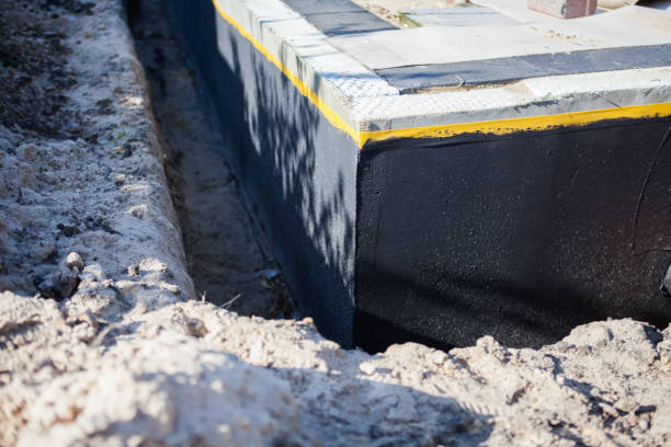 Professional Waterproofing technician working in Riverside, MI